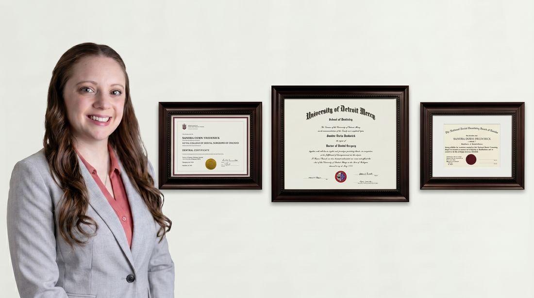 Dr. Sandra Frederick with framed diplomas